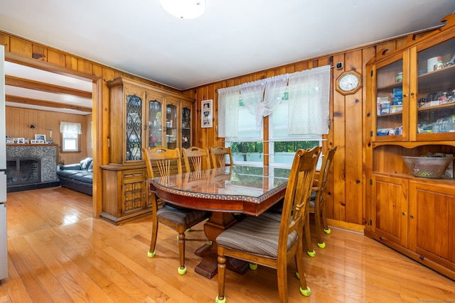 45 Valley Rd, Hamden, CT 06514 - dining room with wooden walls, light wood-style floors, and a fireplace