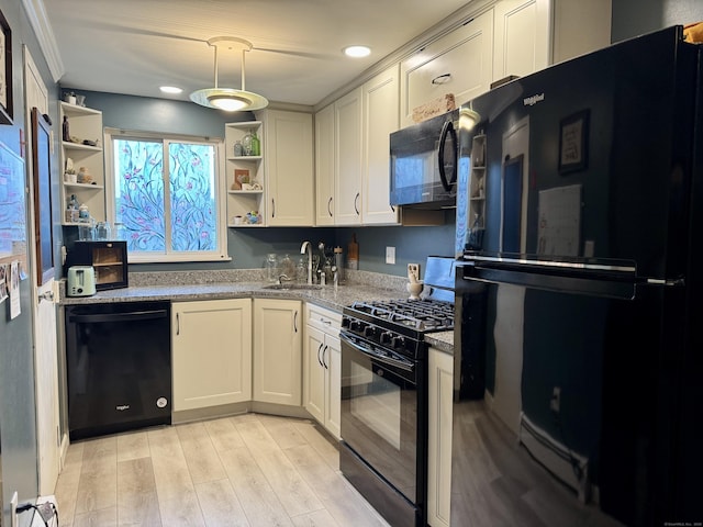 68 Evergreene Unit 68, Wallingford, CT 06492 - kitchen with black appliances, open shelves, a sink, light wood finished floors, and light stone countertops