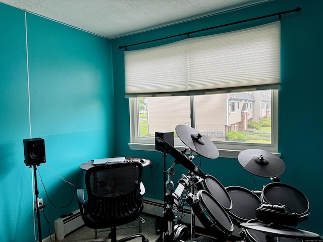 68 Evergreene Unit 68, Wallingford, CT 06492 - exercise area featuring a textured ceiling, a baseboard heating unit, and carpet flooring