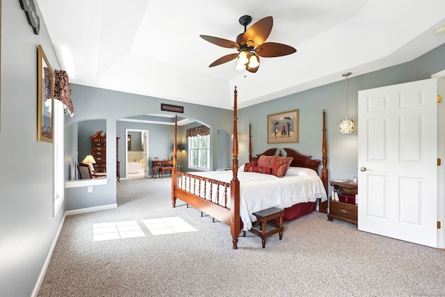 7 Brook Wood Ct, East Windsor, CT 06016 - carpeted bedroom featuring arched walkways, a tray ceiling, ceiling fan, and baseboards