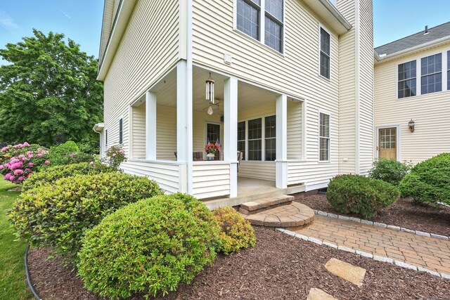 7 Brook Wood Ct, East Windsor, CT 06016 - entrance to property featuring a porch and a chimney