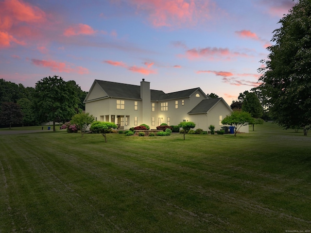 7 Brook Wood Ct, East Windsor, CT 06016 - view of front facade with a chimney and a front lawn