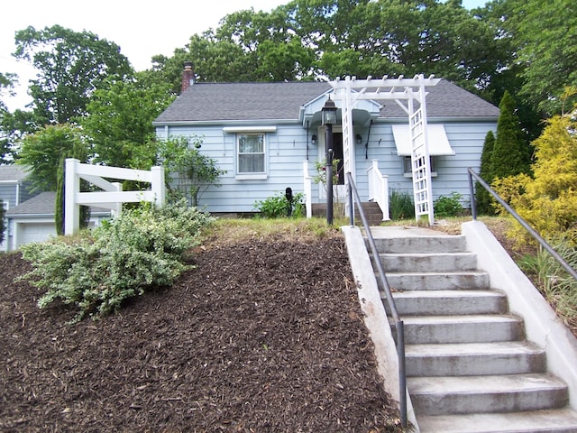 28 Terrace Ave, East Hartford, CT 06108 - bungalow-style house featuring stairway, a chimney, a shingled roof, and a pergola