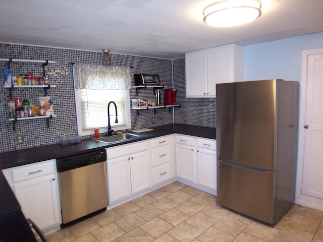 28 Terrace Ave, East Hartford, CT 06108 - kitchen featuring appliances with stainless steel finishes, dark countertops, decorative backsplash, and white cabinets