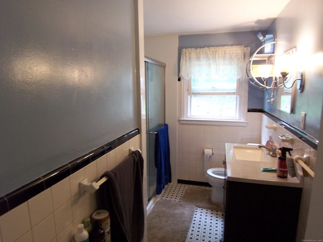 28 Terrace Ave, East Hartford, CT 06108 - full bathroom featuring tile walls, a shower stall, vanity, a chandelier, and a wainscoted wall