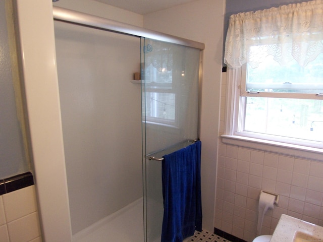 28 Terrace Ave, East Hartford, CT 06108 - bathroom featuring tile walls and a stall shower