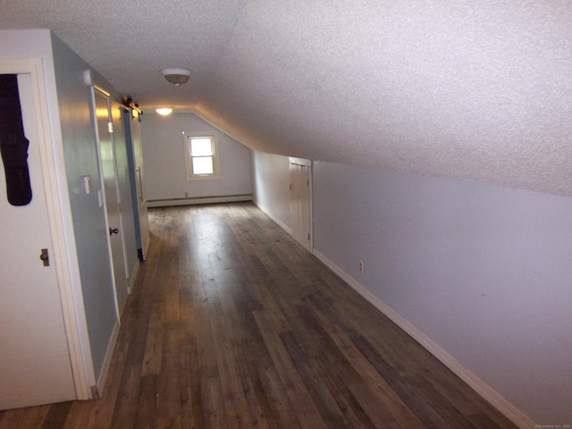 28 Terrace Ave, East Hartford, CT 06108 - bonus room featuring a textured ceiling, a baseboard radiator, lofted ceiling, and dark wood-style flooring