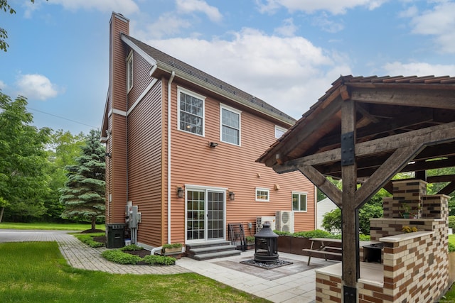 9 Purdum Rd, New Fairfield, CT 06812 - rear view of house featuring a chimney and a patio