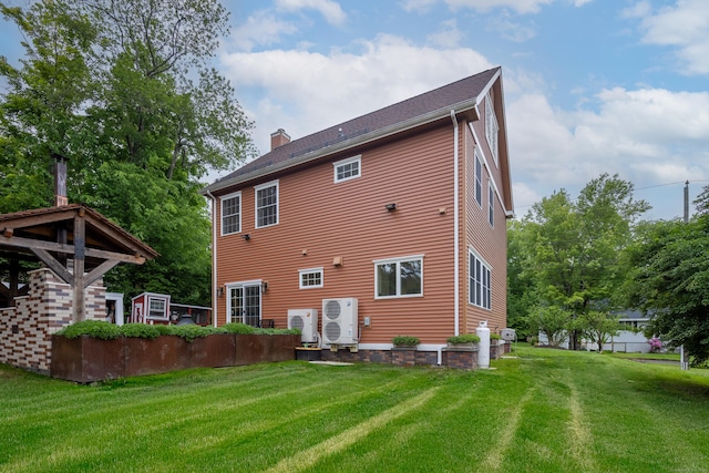 9 Purdum Rd, New Fairfield, CT 06812 - back of property with a chimney, a yard, and a cooling unit