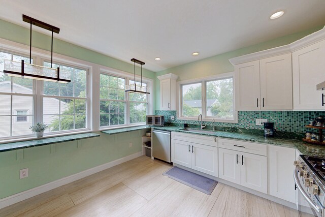 9 Purdum Rd, New Fairfield, CT 06812 - kitchen with appliances with stainless steel finishes, a sink, decorative backsplash, white cabinetry, and recessed lighting
