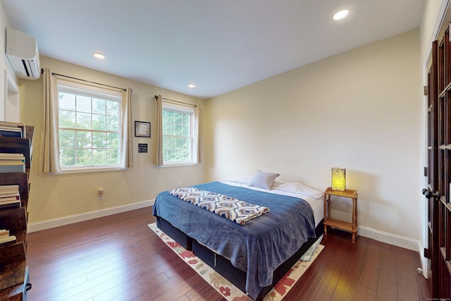 9 Purdum Rd, New Fairfield, CT 06812 - bedroom with an AC wall unit, baseboards, hardwood / wood-style flooring, and recessed lighting