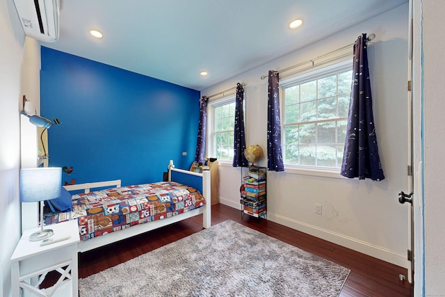 9 Purdum Rd, New Fairfield, CT 06812 - bedroom featuring a wall unit AC, wood finished floors, baseboards, and recessed lighting