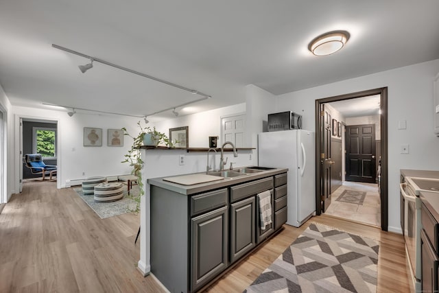 89 Goose Green Rd, Barkhamsted, CT 06063 - kitchen featuring a sink, track lighting, white appliances, and light wood-style flooring