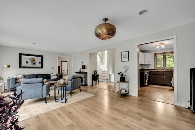 89 Goose Green Rd, Barkhamsted, CT 06063 - living area featuring stairs, light wood-type flooring, and baseboard heating
