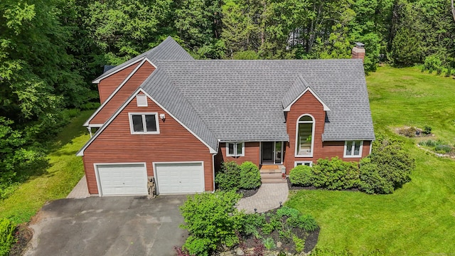 89 Goose Green Rd, Barkhamsted, CT 06063 - a-frame style home with asphalt driveway, a front lawn, a chimney, an attached garage, and a view of trees