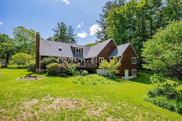 89 Goose Green Rd, Barkhamsted, CT 06063 - rear view of house featuring a chimney, a deck, and a lawn