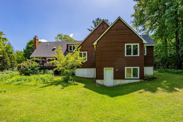 89 Goose Green Rd, Barkhamsted, CT 06063 - rear view of house featuring a chimney, a lawn, a shingled roof, and a deck