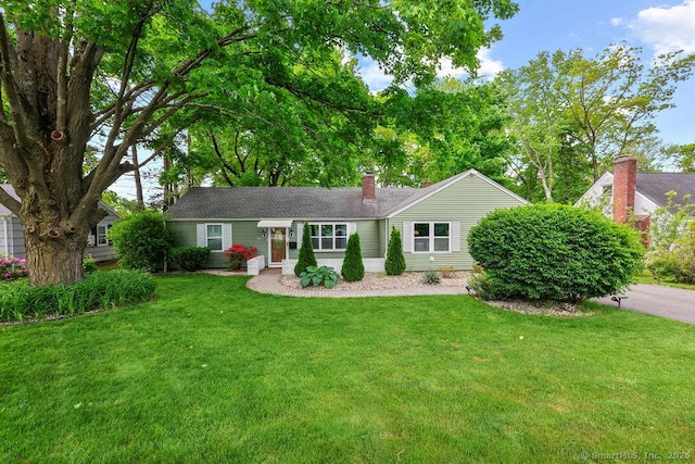 525 Park Ave, Windsor, CT 06095 - ranch-style home with a front yard and a chimney