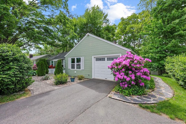 525 Park Ave, Windsor, CT 06095 - view of front of home with driveway and a garage