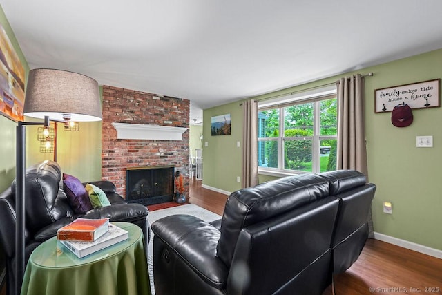 525 Park Ave, Windsor, CT 06095 - living room featuring wood finished floors, a fireplace, and baseboards