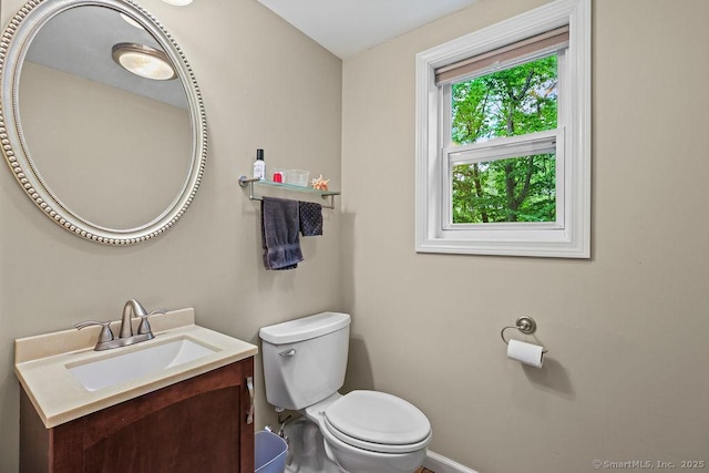 525 Park Ave, Windsor, CT 06095 - half bathroom with vanity, toilet, and baseboards