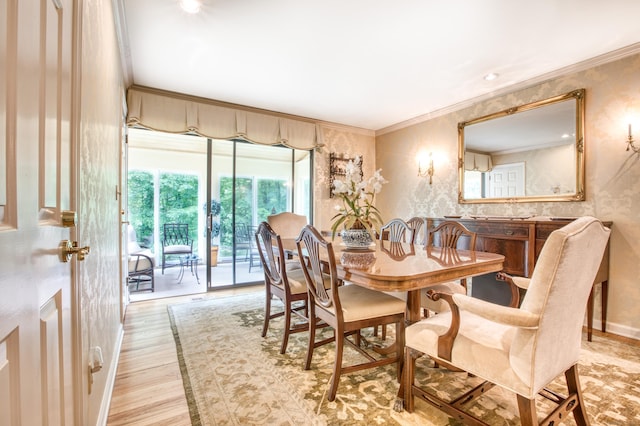 510 W Lyon Farm Dr Unit 510, Greenwich, CT 06831 - dining area featuring wallpapered walls, wood finished floors, crown molding, and baseboards