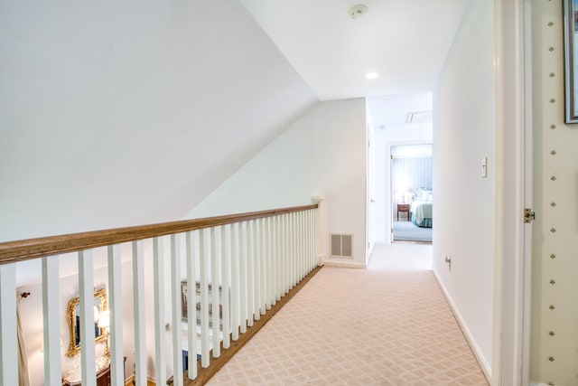 510 W Lyon Farm Dr Unit 510, Greenwich, CT 06831 - corridor featuring attic access, lofted ceiling, and light colored carpet