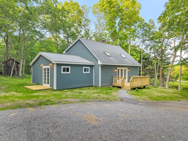 53 Windham Rd, Hampton, CT 06247 - view of front of property featuring french doors, a deck, a chimney, roof with shingles, and a front yard