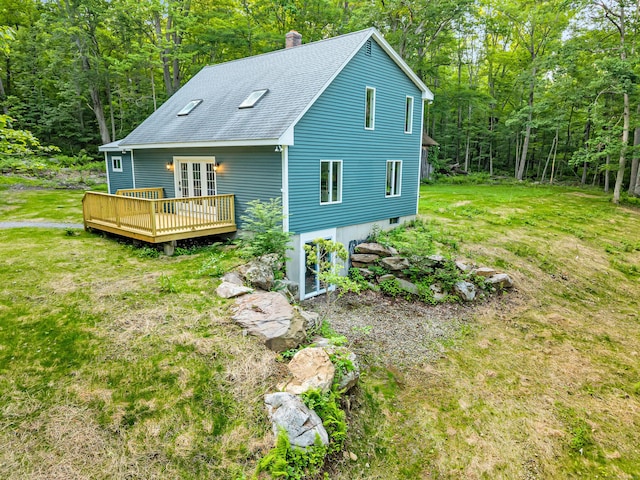 53 Windham Rd, Hampton, CT 06247 - rear view of property with a wooden deck, a chimney, a shingled roof, and a wooded view