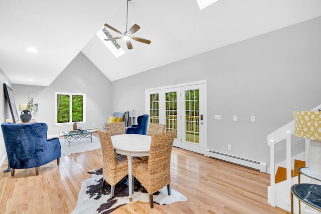 53 Windham Rd, Hampton, CT 06247 - dining space with a skylight, a baseboard radiator, ceiling fan, high vaulted ceiling, and light wood-style floors