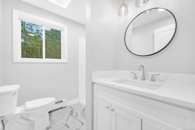 53 Windham Rd, Hampton, CT 06247 - bathroom with marble finish floors, a baseboard radiator, vanity, toilet, and baseboards
