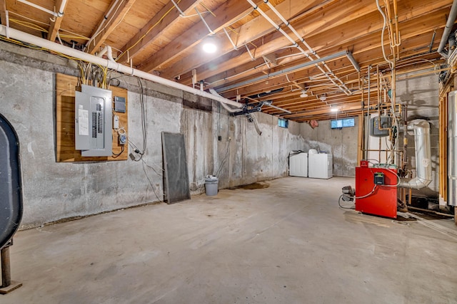 53 Windham Rd, Hampton, CT 06247 - unfinished basement featuring electric panel, a heating unit, and washer and dryer