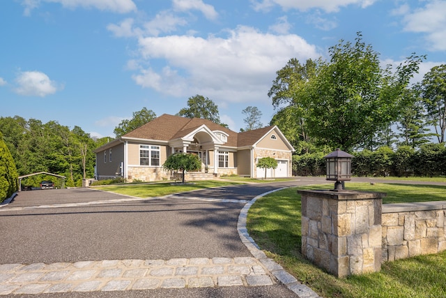 125 Stadley Rough Rd, Danbury, CT 06811 - view of front of house featuring a garage, asphalt driveway, a front lawn, and stone siding