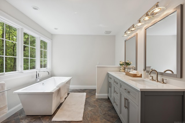 24 Pine Mountain Rd, Redding, CT 06896 - full bath featuring double vanity, a freestanding tub, baseboards, and stone finish flooring
