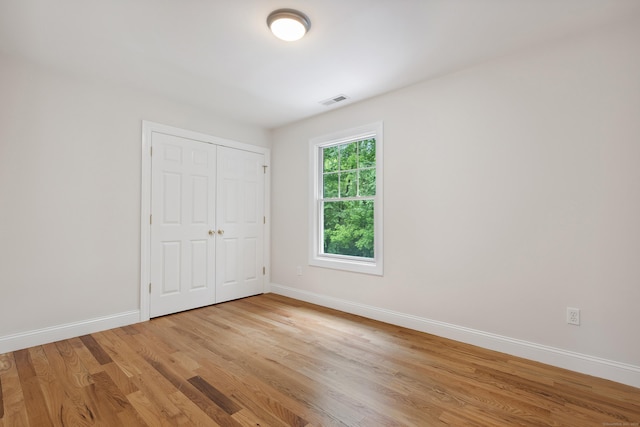24 Pine Mountain Rd, Redding, CT 06896 - unfurnished bedroom featuring baseboards, light wood-type flooring, and a closet
