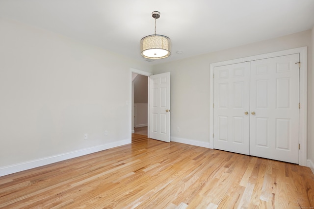 24 Pine Mountain Rd, Redding, CT 06896 - unfurnished bedroom with wood finished floors, baseboards, and a closet