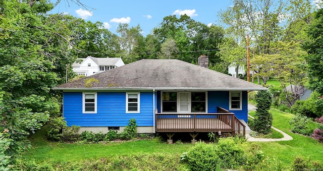 5 Reservoir Rd, Norwich, CT 06360 - view of front of property featuring a chimney, a front yard, roof with shingles, and view of scattered trees