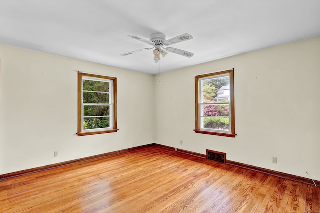 5 Reservoir Rd, Norwich, CT 06360 - empty room featuring healthy amount of natural light, light wood-type flooring, ceiling fan, and baseboards