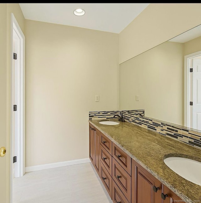 10 Secor Rd, Brookfield, CT 06804 - full bathroom with double vanity, tile patterned floors, baseboards, backsplash, and recessed lighting