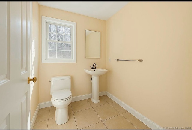 10 Secor Rd, Brookfield, CT 06804 - half bathroom featuring toilet, tile patterned floors, baseboards, and a sink