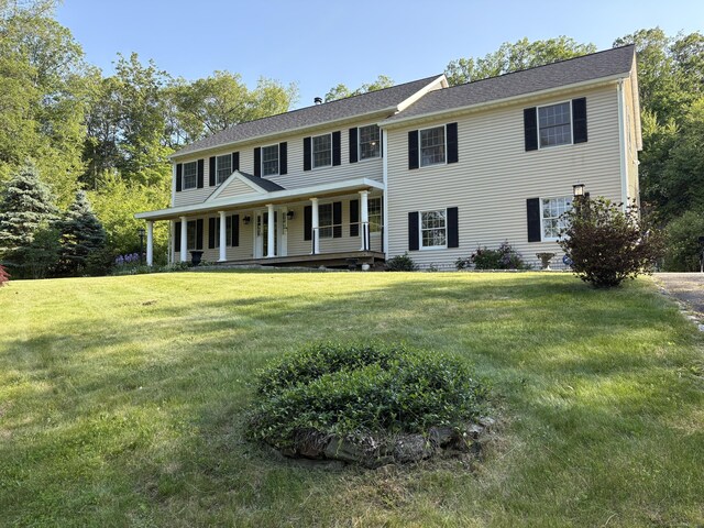 10 Secor Rd, Brookfield, CT 06804 - colonial-style house with a porch and a front yard