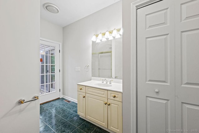 657 Tamarack Rd, Cheshire, CT 06410 - bathroom with vanity, a shower with door, a closet, baseboards, and tile patterned floors