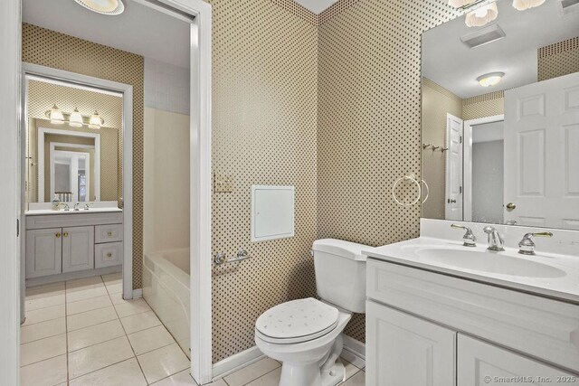 657 Tamarack Rd, Cheshire, CT 06410 - full bath with tile patterned floors, vanity, toilet, and bathtub / shower combination