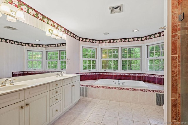 657 Tamarack Rd, Cheshire, CT 06410 - bathroom featuring plenty of natural light, a garden tub, tile patterned flooring, and double vanity