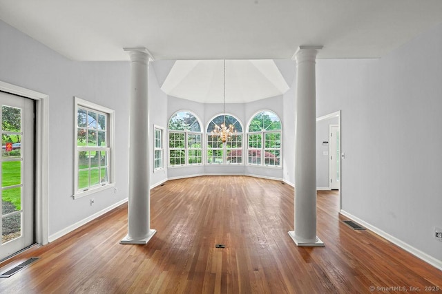 657 Tamarack Rd, Cheshire, CT 06410 - unfurnished living room with decorative columns, baseboards, and wood finished floors