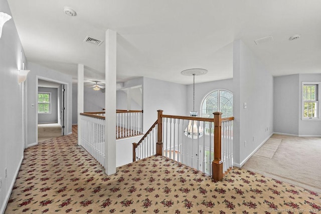 657 Tamarack Rd, Cheshire, CT 06410 - hall featuring carpet, healthy amount of natural light, an upstairs landing, and baseboards
