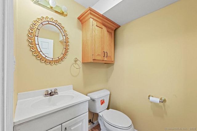 657 Tamarack Rd, Cheshire, CT 06410 - bathroom with toilet, vanity, and baseboards