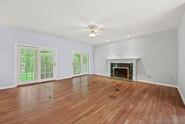 657 Tamarack Rd, Cheshire, CT 06410 - unfurnished living room featuring a ceiling fan, wood finished floors, a premium fireplace, baseboards, and recessed lighting