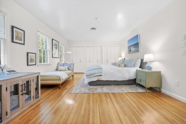 30 Norfield Woods Rd, Weston, CT 06883 - bedroom featuring light wood-style flooring, two closets, and baseboards