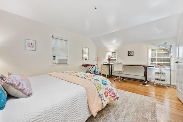30 Norfield Woods Rd, Weston, CT 06883 - bedroom with wood finished floors, lofted ceiling, baseboard heating, and cooling unit